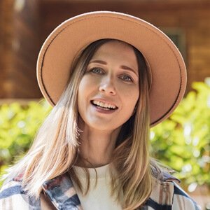 happy woman with blonde hair smiling outdoor at sp zq6gjwm.jpg